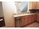 Functional kitchen with stainless steel dishwasher, light wood cabinets, and contrasting tile backsplash at 292 Nautica Mile Dr, Clermont, FL 34711