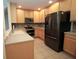 Spacious kitchen features stainless steel appliances, ample cabinetry, and tile flooring at 292 Nautica Mile Dr, Clermont, FL 34711