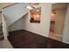 Inviting living room with hardwood floors, ceiling fan, and a glimpse into the kitchen at 292 Nautica Mile Dr, Clermont, FL 34711