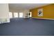 Large meeting room with plenty of space for gatherings and a bright yellow wall at 292 Nautica Mile Dr, Clermont, FL 34711