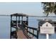 Waterfront view of a covered pier on a calm day at Clermont Yacht Club beach at 292 Nautica Mile Dr, Clermont, FL 34711