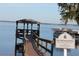Waterfront view of a covered pier on a calm day at Clermont Yacht Club beach at 292 Nautica Mile Dr, Clermont, FL 34711