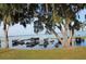 Scenic waterfront showcasing boat docks and lush trees, offering a serene and picturesque view at 292 Nautica Mile Dr, Clermont, FL 34711