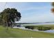 Picturesque waterfront view with lush greenery and boat docks, offering a serene and inviting lakeside setting at 292 Nautica Mile Dr, Clermont, FL 34711