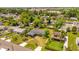 An aerial view of a neighborhood with lush greenery, showcasing the house and surrounding landscape at 2928 Delaney St, Orlando, FL 32806