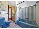 Vintage bathroom featuring colorful tiling, retro fixtures, and a classic bathtub at 2928 Delaney St, Orlando, FL 32806
