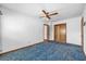 Bedroom with a vintage carpet flooring and ceiling fan at 2928 Delaney St, Orlando, FL 32806