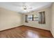 Bedroom with a ceiling fan and hardwood floors, providing a bright living space at 2928 Delaney St, Orlando, FL 32806