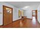 Hardwood floors and an exterior door create a stylish and inviting entryway for guests at 2928 Delaney St, Orlando, FL 32806