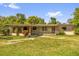 Charming single-story home with a covered porch and well-maintained lawn, perfect for relaxing outdoors at 2928 Delaney St, Orlando, FL 32806