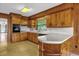 Traditional style kitchen featuring wooden cabinetry and light countertops at 2928 Delaney St, Orlando, FL 32806