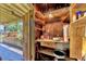 Outdoor storage space with wooden shelving and tools at 2928 Delaney St, Orlando, FL 32806