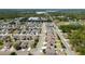Neighborhood aerial view showing the home's location among tree-lined streets and similar residences at 3002 Bethpage Loop, Mount Dora, FL 32757