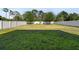 Expansive backyard with lush green lawn and full fence at 3002 Bethpage Loop, Mount Dora, FL 32757
