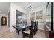 A dining room featuring a modern table with views out the window at 3002 Bethpage Loop, Mount Dora, FL 32757