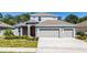 Charming two-story home features a two car garage, well-manicured lawn and tasteful landscaping at 3002 Bethpage Loop, Mount Dora, FL 32757