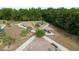 Aerial view of a colorful playground with modern equipment and a picnic pavilion at 3002 Bethpage Loop, Mount Dora, FL 32757