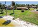 Picturesque lakeside property with a well-maintained lawn and brick accents on the home at 301 Waterwood Dr, Yalaha, FL 34797