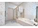 Relaxing bathroom with a tub and shower combo, complemented by neutral tones and elegant fixtures at 301 Waterwood Dr, Yalaha, FL 34797
