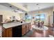 Open kitchen and breakfast nook with lake views at 301 Waterwood Dr, Yalaha, FL 34797