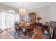 Charming dining room with hardwood floors, a chandelier, and decorative hutch at 301 Waterwood Dr, Yalaha, FL 34797