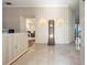 Elegant foyer with marble floors, decorative wallpaper, and a unique grandfather clock at 301 Waterwood Dr, Yalaha, FL 34797