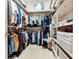 Functional walk-in closet with ample shelving and hanging space for optimal organization at 301 Waterwood Dr, Yalaha, FL 34797