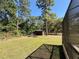 Large, fenced backyard with a storage shed and plenty of green space at 30554 Quince Ave, Eustis, FL 32736