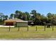Backyard featuring a large yard, screened-in patio, and a shed for extra storage and outdoor enjoyment at 30554 Quince Ave, Eustis, FL 32736