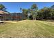 Large backyard featuring a screened pool and shed at 30554 Quince Ave, Eustis, FL 32736