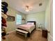 Relaxing bedroom with a ceiling fan, a window with blinds, and carpeted floors at 30554 Quince Ave, Eustis, FL 32736