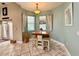 Cozy breakfast nook features a charming table set, bright windows, and a relaxing atmosphere at 30554 Quince Ave, Eustis, FL 32736