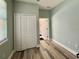 Bright flex room with an expansive window, closet and wood-look floors at 30554 Quince Ave, Eustis, FL 32736