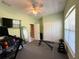 Versatile gym space with exercise equipment, a TV, and bright natural lighting at 30554 Quince Ave, Eustis, FL 32736