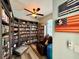 Charming library featuring built-in bookshelves, a comfortable chair, and unique decor at 30554 Quince Ave, Eustis, FL 32736