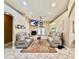 Open living room with tile floors, a fireplace, and neutral décor, perfect for relaxing and entertaining at 30554 Quince Ave, Eustis, FL 32736