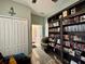 Comfortable living room featuring a large bookcase and view to the entry at 30554 Quince Ave, Eustis, FL 32736
