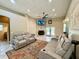 Spacious living room featuring tile floors, fireplace, ceiling fan, and comfortable seating at 30554 Quince Ave, Eustis, FL 32736
