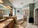 Beautiful bathroom with a walk-in shower, soaking tub, and dual sinks offers a spa-like experience in the comfort of home at 30554 Quince Ave, Eustis, FL 32736
