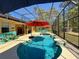 View of the stunning, screened-in pool with outdoor seating at 30554 Quince Ave, Eustis, FL 32736