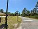 Road intersection with a Quince St sign and a partial view of the property at 30554 Quince Ave, Eustis, FL 32736