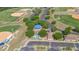 An aerial view showcasing a community park with basketball court, playground and pavilion with covered picnic tables at 31799 Broadwater Ave, Leesburg, FL 34748