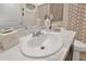 Bathroom sink with white countertop, modern faucet, neutral paint and stylish toiletries at 31799 Broadwater Ave, Leesburg, FL 34748