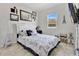 Paris themed bedroom with decorative touches, neutral paint, and a large window at 31799 Broadwater Ave, Leesburg, FL 34748