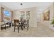 Cozy dining area features a modern chandelier, stylish decor, and seating for four at 31799 Broadwater Ave, Leesburg, FL 34748