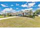 Charming single-story home with a well-maintained lawn, complemented by a two-car garage and vibrant green shrubbery at 31799 Broadwater Ave, Leesburg, FL 34748