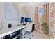 Bright home office space with a modern desk, large world map, and natural light at 31799 Broadwater Ave, Leesburg, FL 34748