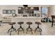 Stylish kitchen island with seating, modern appliances, and an open layout perfect for entertaining at 31799 Broadwater Ave, Leesburg, FL 34748
