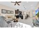 Open concept living room and kitchen space features modern décor and lots of natural light at 31799 Broadwater Ave, Leesburg, FL 34748