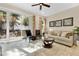 Bright living room with sliding glass doors leading to outdoor area, stylish decor and neutral color palette at 31799 Broadwater Ave, Leesburg, FL 34748